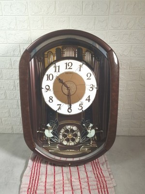 Seiko QXM297B Melodies in Motion Uhr mit bunten funkelnden Lichtern in Box