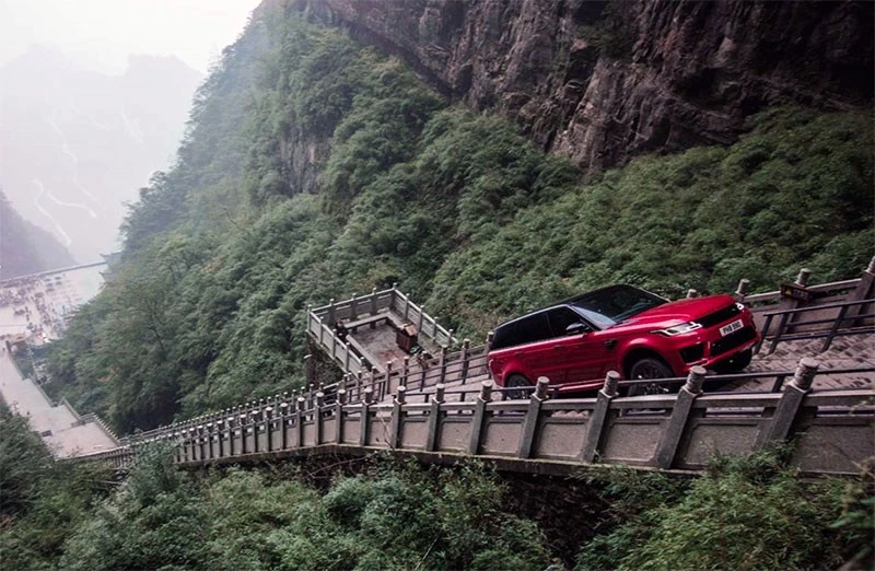 A Range Rover Sports at Heaven’s Gate Arch rock in Hunan Province, China.