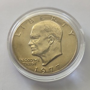 1977 (P) Eisenhower Dollar AU, Toned in Capsule