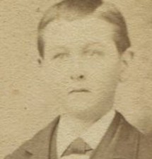 BOY STANDING AT CHAIR WITH BOWLER HAT ON SEAT.  CDV. ST. PETER, MINN.