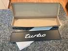 PORSCHE DESIGN OEM TIN EURO BLACK LICENSE PLATE W/WHITE TURBO. MADE IN GERMANY.