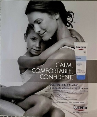 2014 Eucerin Print Ad Mother with Daughter hugging happy smiling.