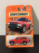 MATCHBOX 2024 MOUNTAIN EXPLORERS 54/100 - 1985 NISSAN PATHFINDER RED