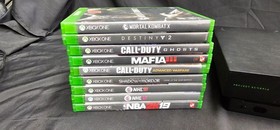 Microsoft Xbox One X with 1 controller, 4TB External Hard Drive, & 9 Games