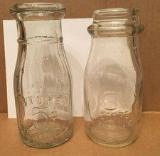 TWO HALF-PINT STORE MILK BOTTLES - 3 CENTS AND 5 CENTS - EMBOSSED LETTERING