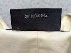 Black Faconnable Vest women’s medium garment with white printed text “DRY CLEAN ONLY” and red flag at bottom.