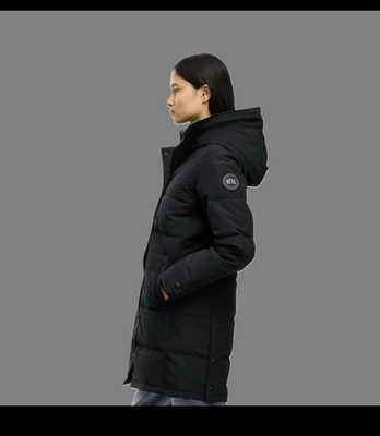 Clean lines and winter warmth   a sleek black puffer coat with a modern look.