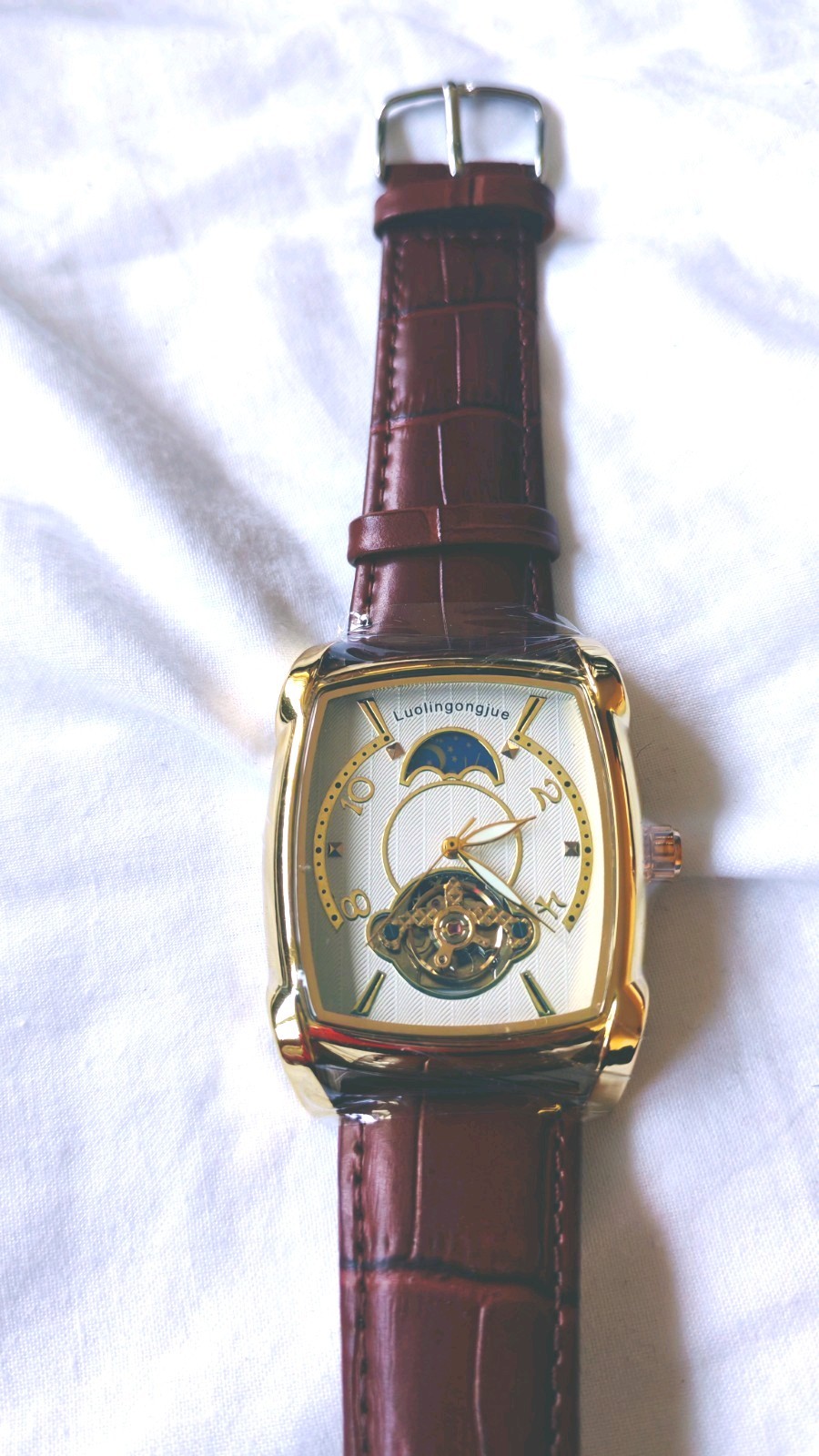 Montre automatique Luolingongjue en or et cuir marron, l'élégance horlogère intemporelle au poignet