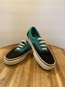 teal and black vans