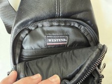 Westend black synthetic leather crossbody, 4 zipper pockets, adjust strap, new