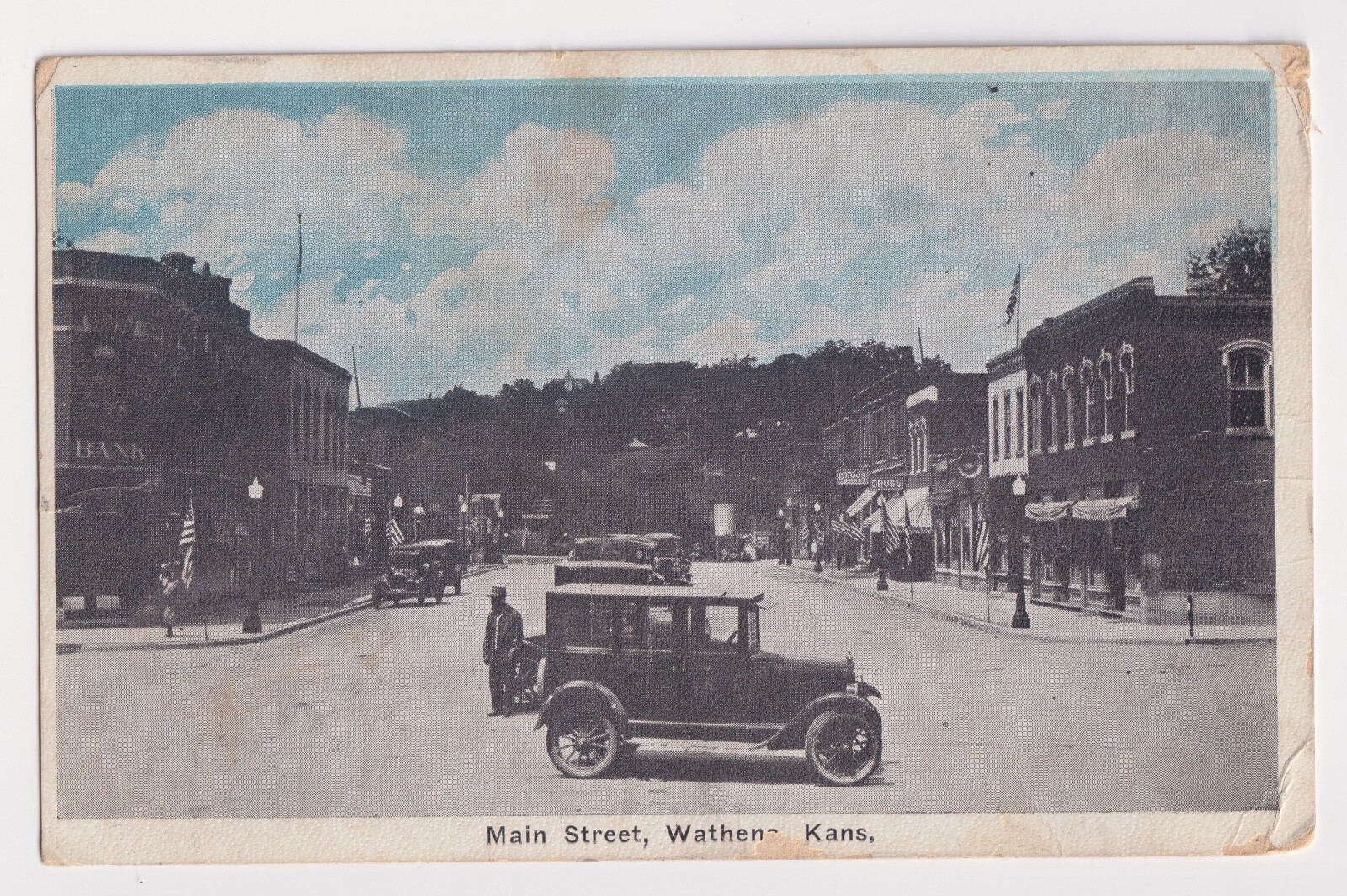 VIEW OF MAIN STREET WATHENA KANSAS BANK, DRUG STORE & AMERICAN FLAGS