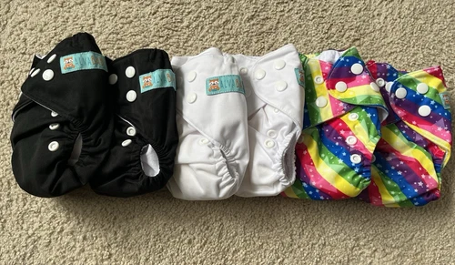 Alva Baby Newborn Cloth Diapers. 6 total: 2 white, 2 black, 2 rainbow with stars