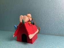 Snoopy Laying On His Doghouse