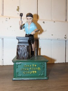 Bank on John Deere Quality cast iron mechanical blacksmith w/ anvil coin bank