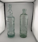 Lot of 2 Vintage Wine Clear Embossed Glass Bottles Collectible — photo 1