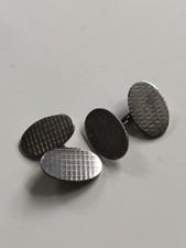 Vintage sterling silver oval chain-linked cufflinks. Machine engraved.
