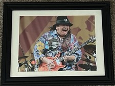 CARLOS SANTANA Autographed signed 8 X 11.5 photo Rock Guitar Legend