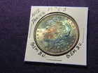 1885-O Morgan dollar in Gem B.U. condition with nice toning