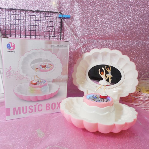 Caja de música intermitente LED con forma de concha, Juguete Musical para niño