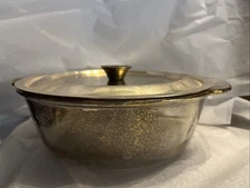 Vintage Fire-King Georges Briard 2-quart casserole dish with a gold lid