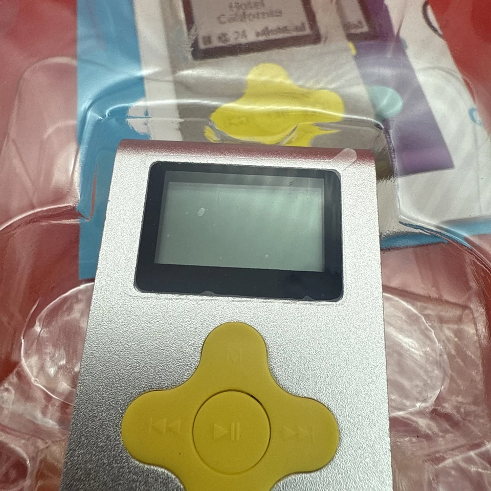 Reproductor MP3 Eclipse Fit Clip 4 GB Nuevo en Caja Sellado Color PLATA/AMARILLO Nunca Usado Foto 2 de 2