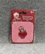 NEW STRAWBERRY SHORTCAKE CHARACTER ON A STRAWBERRY LAPEL PIN BUTTON CUTE RARE