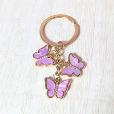 Butterfly Keychain Gold color with purple and rhinestones