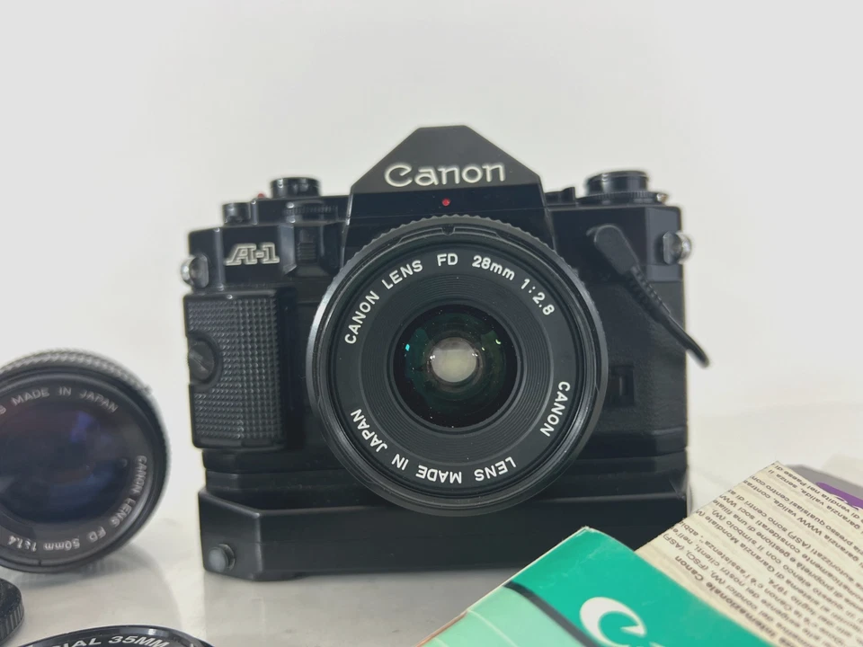 Cámara fotográfica Canon A-1 negra 35 mm FD 28 mm f2,8 lente con 50 mm 1:1,4 | Paquete Foto 2 de 4