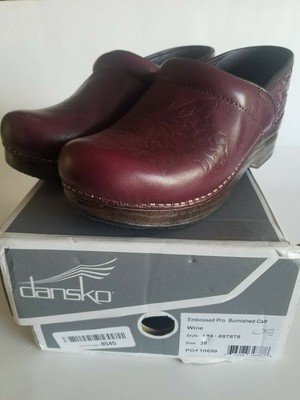 dansko embossed clogs