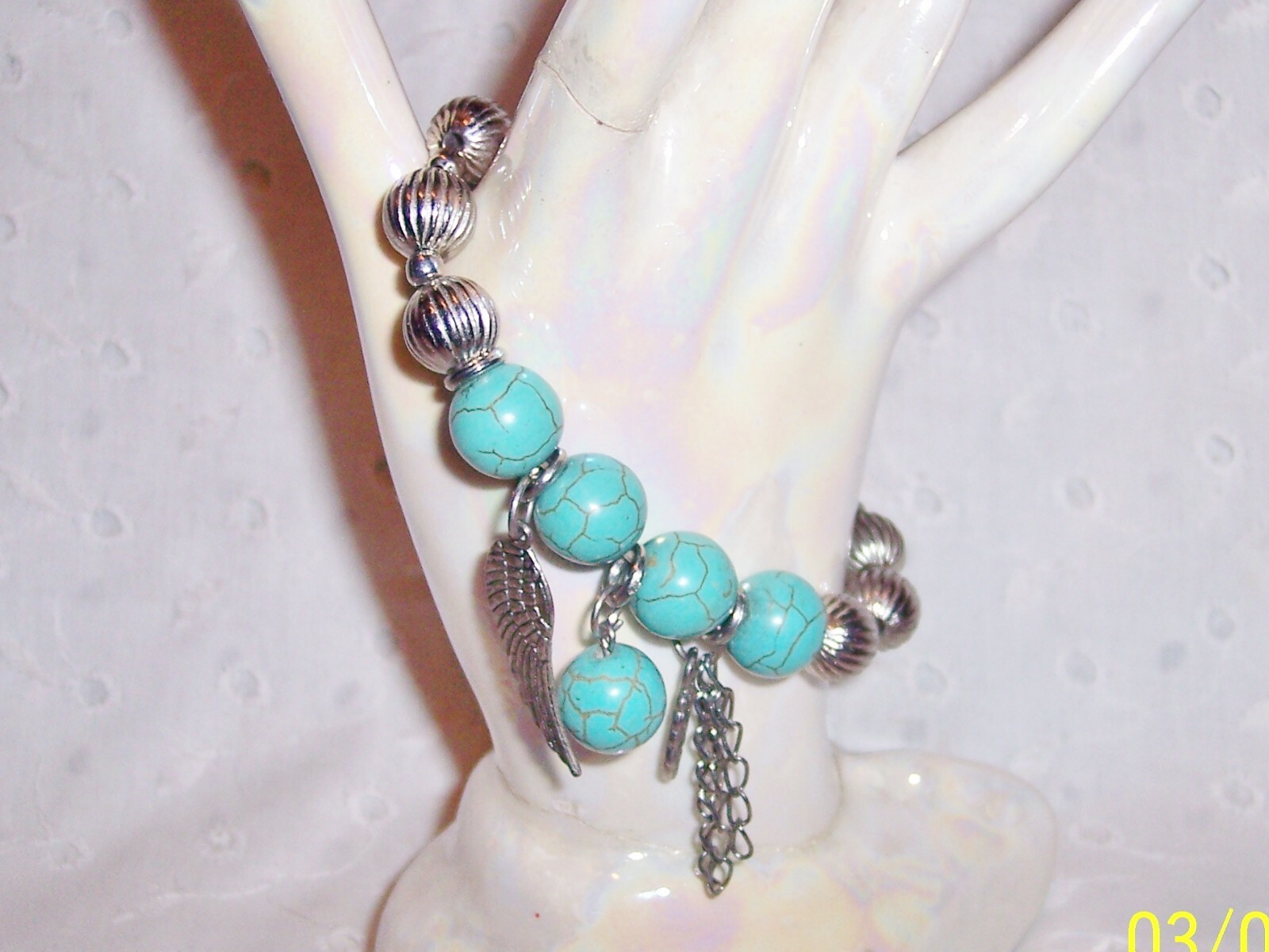 Turquoise Blue Silver Stretch Bracelet with Dangling Wing Feather Chains-image