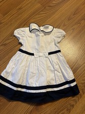 Style: Classic, traditional dress with a timeless look 	  