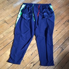 Nike Blue Track Pants with Green and Red Accents