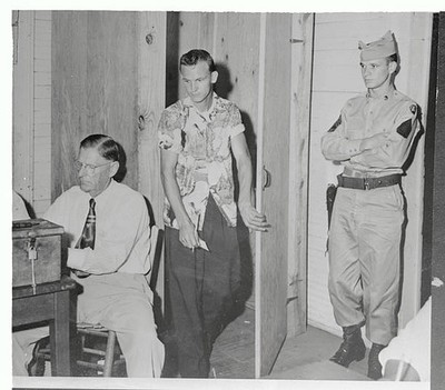 National Guardsman Sgt 1st Class James Carnley stands guard at pol- Old Photo