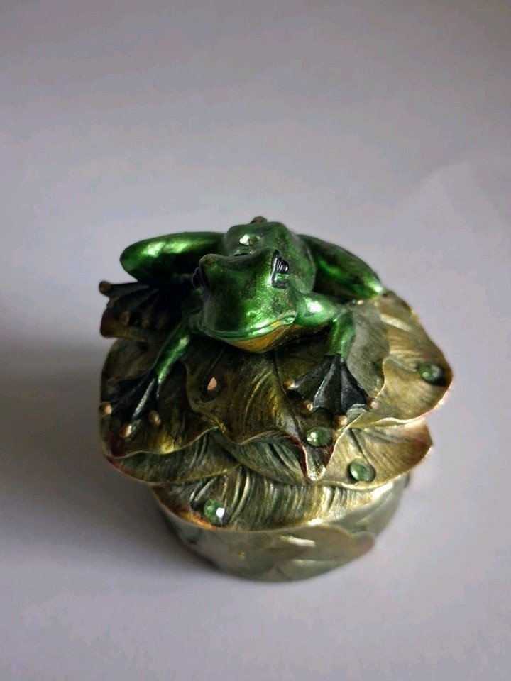 A hand-painted crystal frog perched on a lily pad trinket box — the kind of whimsical, tactile vintage piece that feels genuinely special rather than mass-produced.