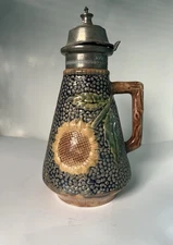 Griffin, Smith &Hill Etruscan Majolica Sunflower Syrup Pitcher with a pewter lid