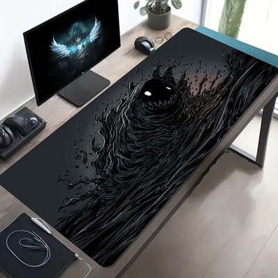 A Large Gaming Mouse Pad Featuring a Black Fluid-Like Pattern That Ripples on T