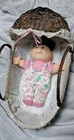 (D9) Cabbage Patch Kids Lil Swaddler  9 inch baby doll complete with wicker crib