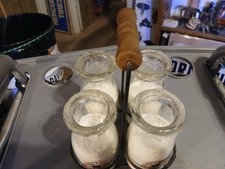 AWESOME LOT OF 4 MILK OR CREAM BOTTLES IN RACK......LOOK