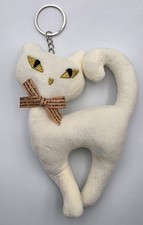 cat plush keychain features distinctive embroidered yellow eyes and a printed...