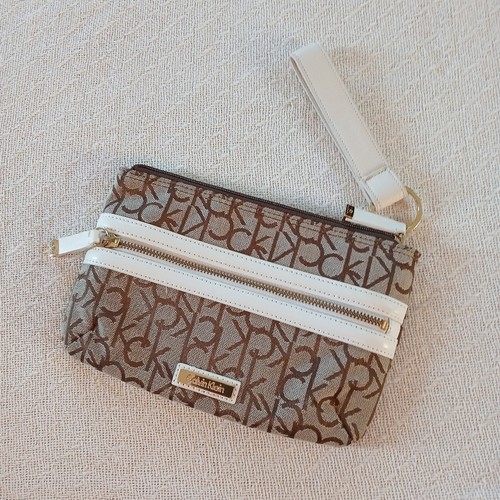 calvin klein monogram canvas wristlet bag white leather trim jacquard iconic