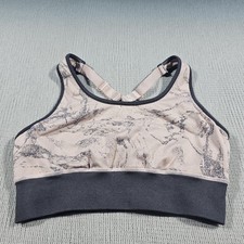Fabletics Eliza seamless sports bra features a distinctive mauve swirl marble...