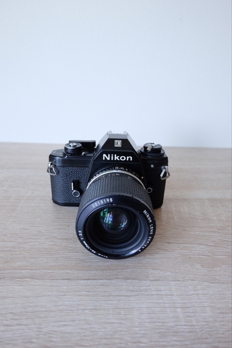 Black Nikon EM 35mm SLR Film Rangefinder Camera Body & Lens Black Nikon EM 35mm SLR Film Rangefinder Camera Body & Lens