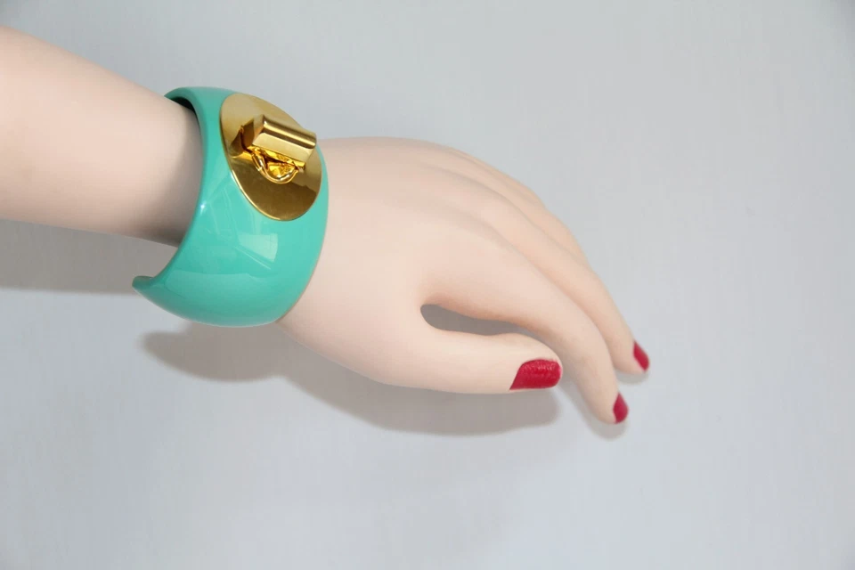 Brazalete Coach Aqua acrílico dorado Turnlock. RARO Precioso Grueso