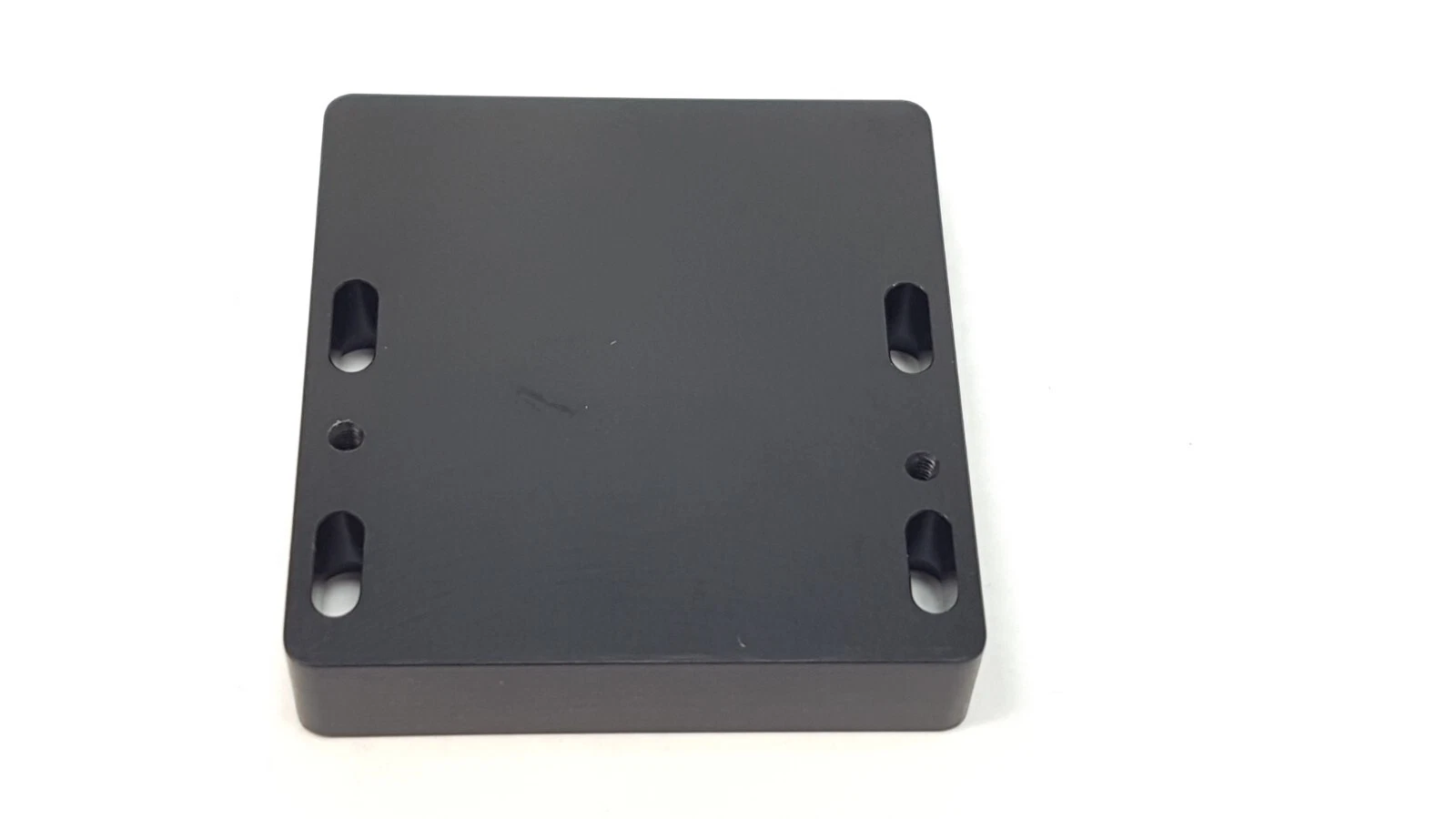 MM-004324 Dynamic TEC Buffer back face at an angle, showing edge thickness