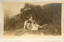 French Alps Friends On Alps Mountain Side Laying On Ground