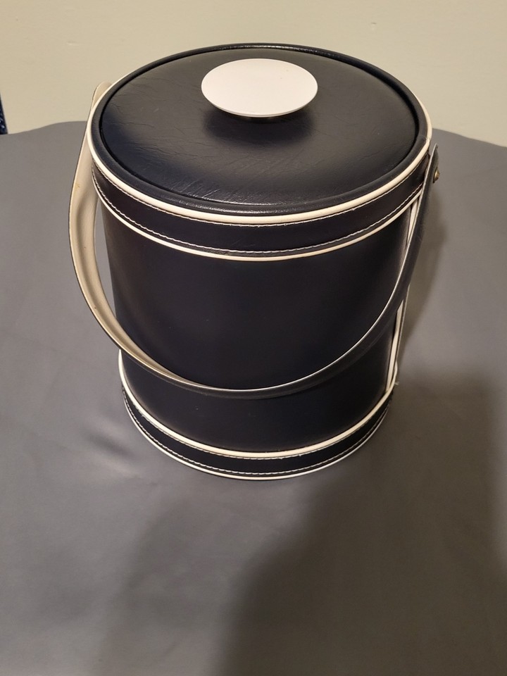 Georges Briard was THE name in 1960s American barware — this navy and white ice bucket is a signed piece of mid-century entertaining history.