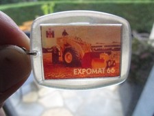 Porte-clefs ancien publicitaire café "EXPOMAT 66" engin travaux public