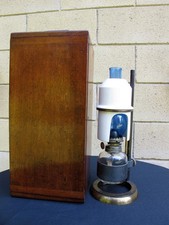Cased antique brass microscope oil lamp. Ceramic and blue glass chimney.