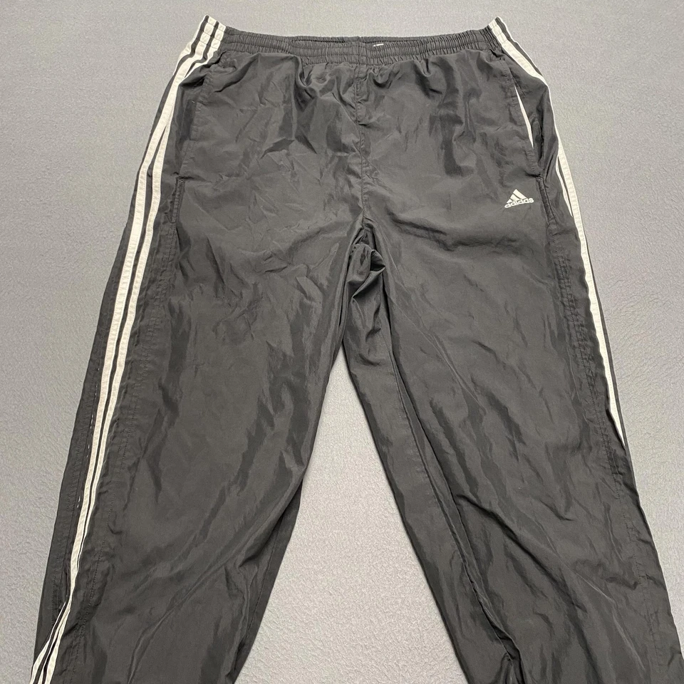 Pantalones Adidas Para Hombre Medianos Negros Calentamiento de Pista 3 Rayas Cremallera Forrados al Tobillo Nylon Foto 3 de 4