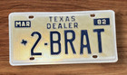 TXS 1982  VANITY DEALER  LICENSE PLATE " 2 BRAT "  SUZUKI  NEW USED CAR DLR